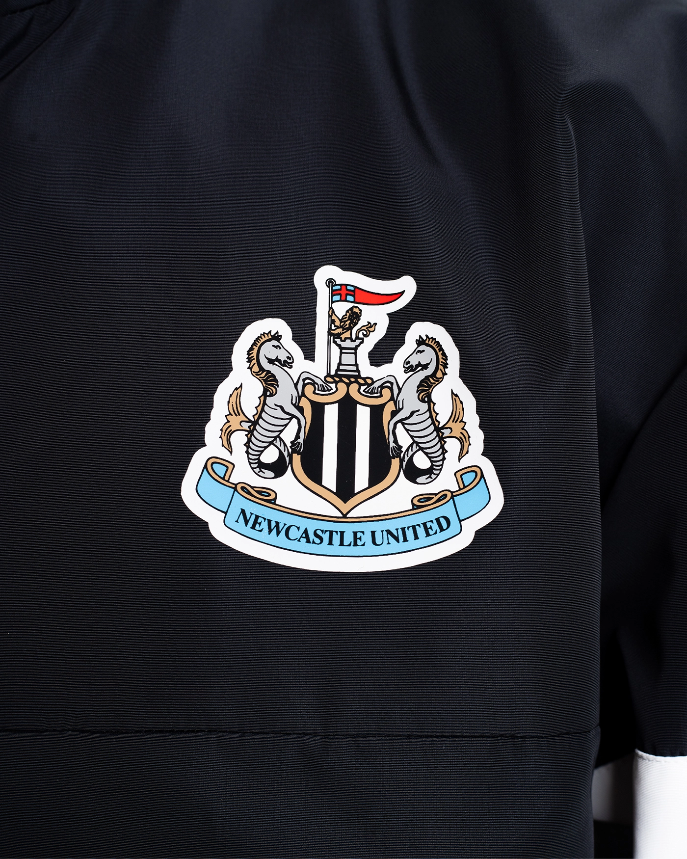 Newcastle United Black Quarter Zip Cagoule