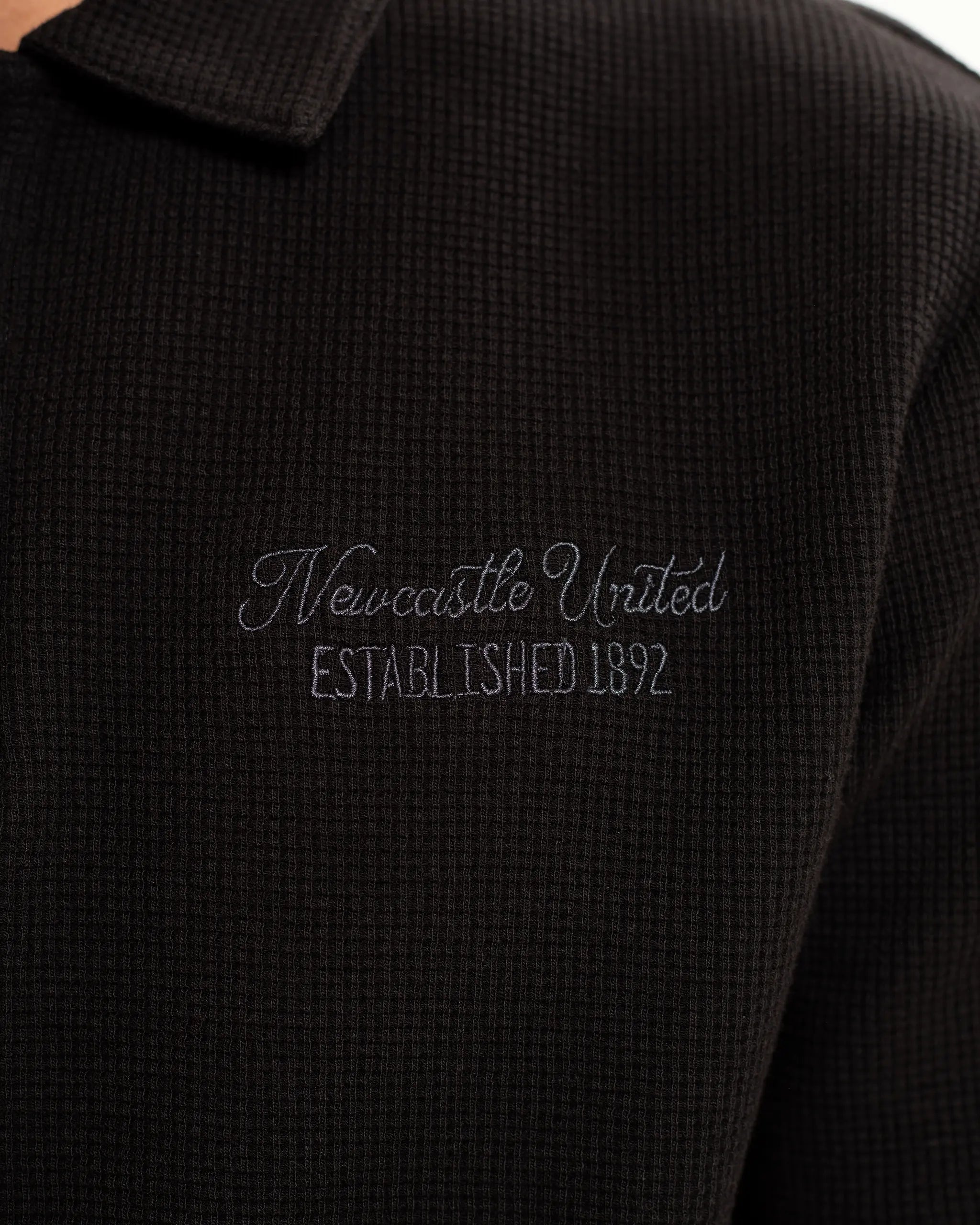 Newcastle United Men's Black Waffle Open Neck Polo Shirt