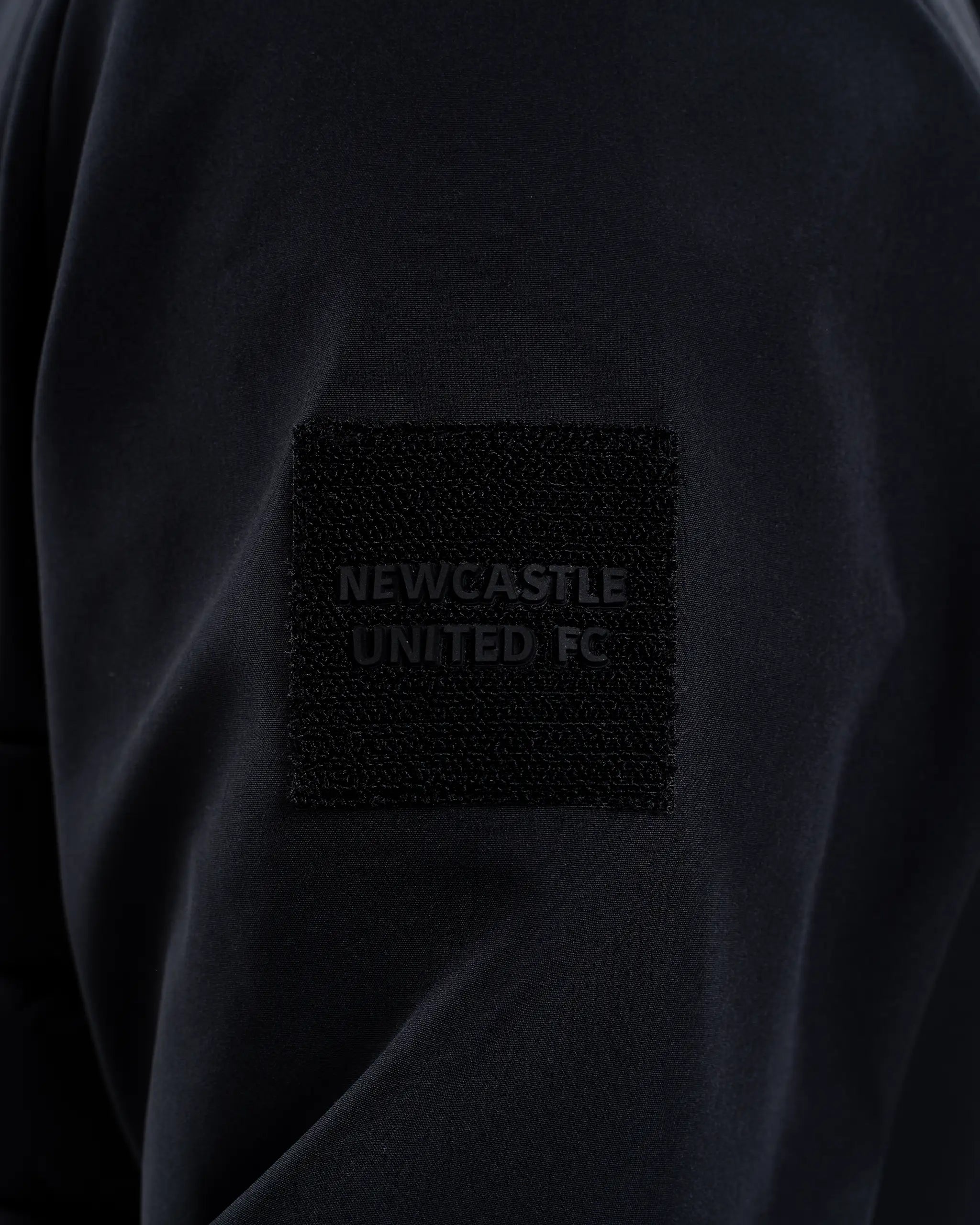 Newcastle United Black Hooded Hybrid Jacket