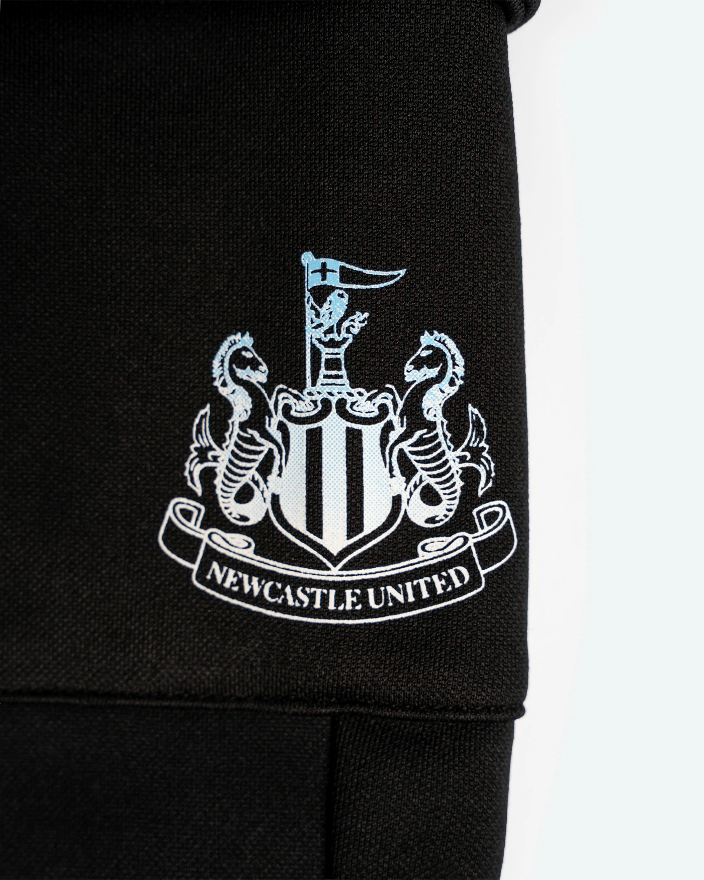 Newcastle United Boy's Black Joggers with Blue Ombre Crest
