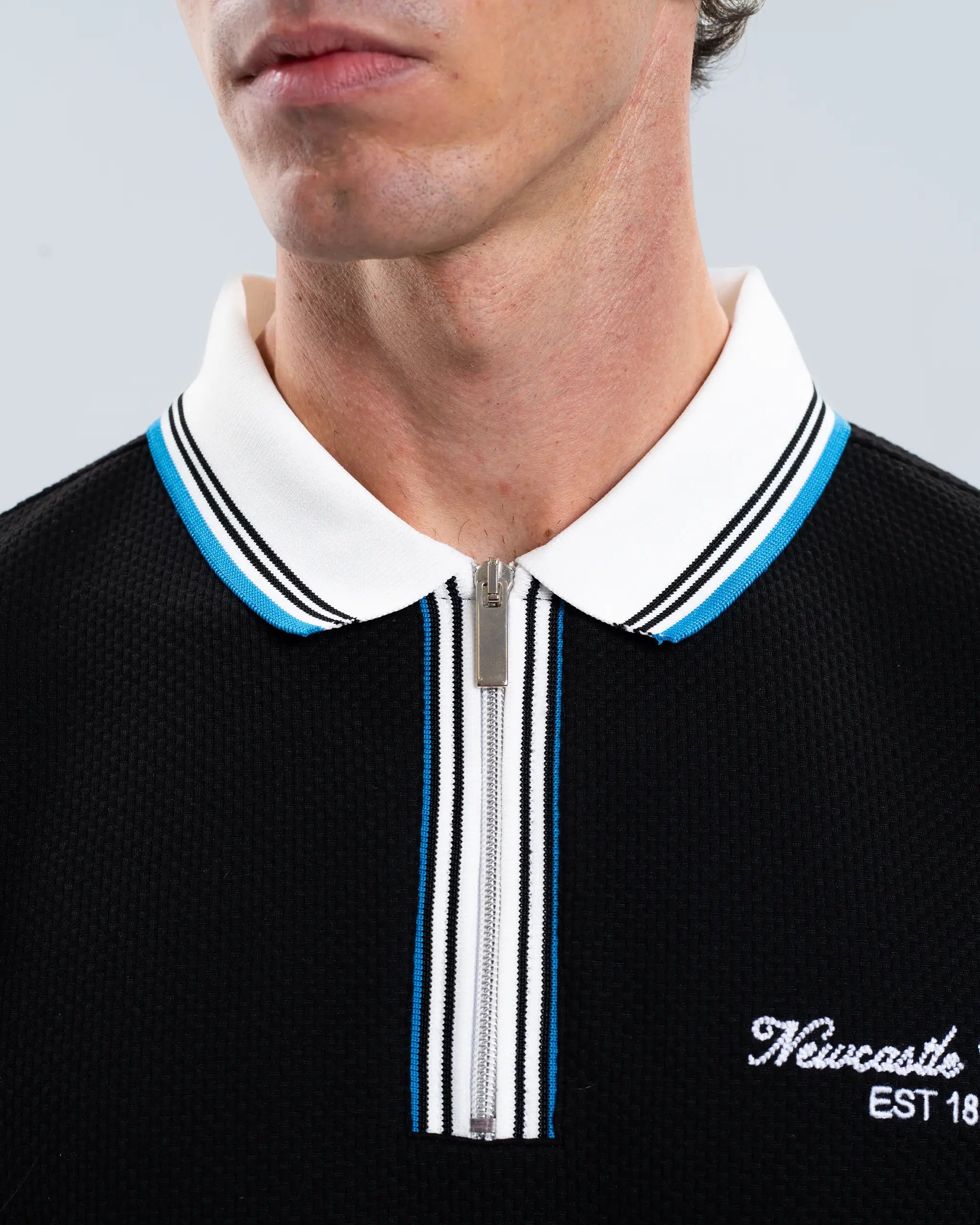Newcastle United Men's Zipped Black Polo Shirt
