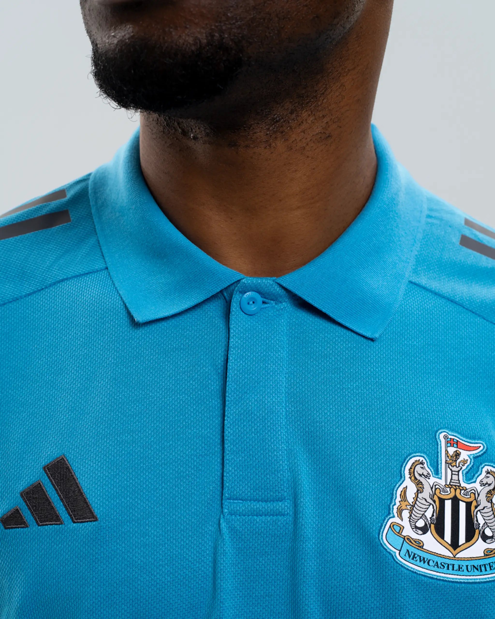 Newcastle United adidas 25/26 Players Range Blue Polo Shirt
