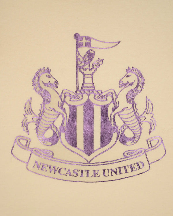 Newcastle United Girl's Cream T-Shirt With Lilac Shimmer Crest