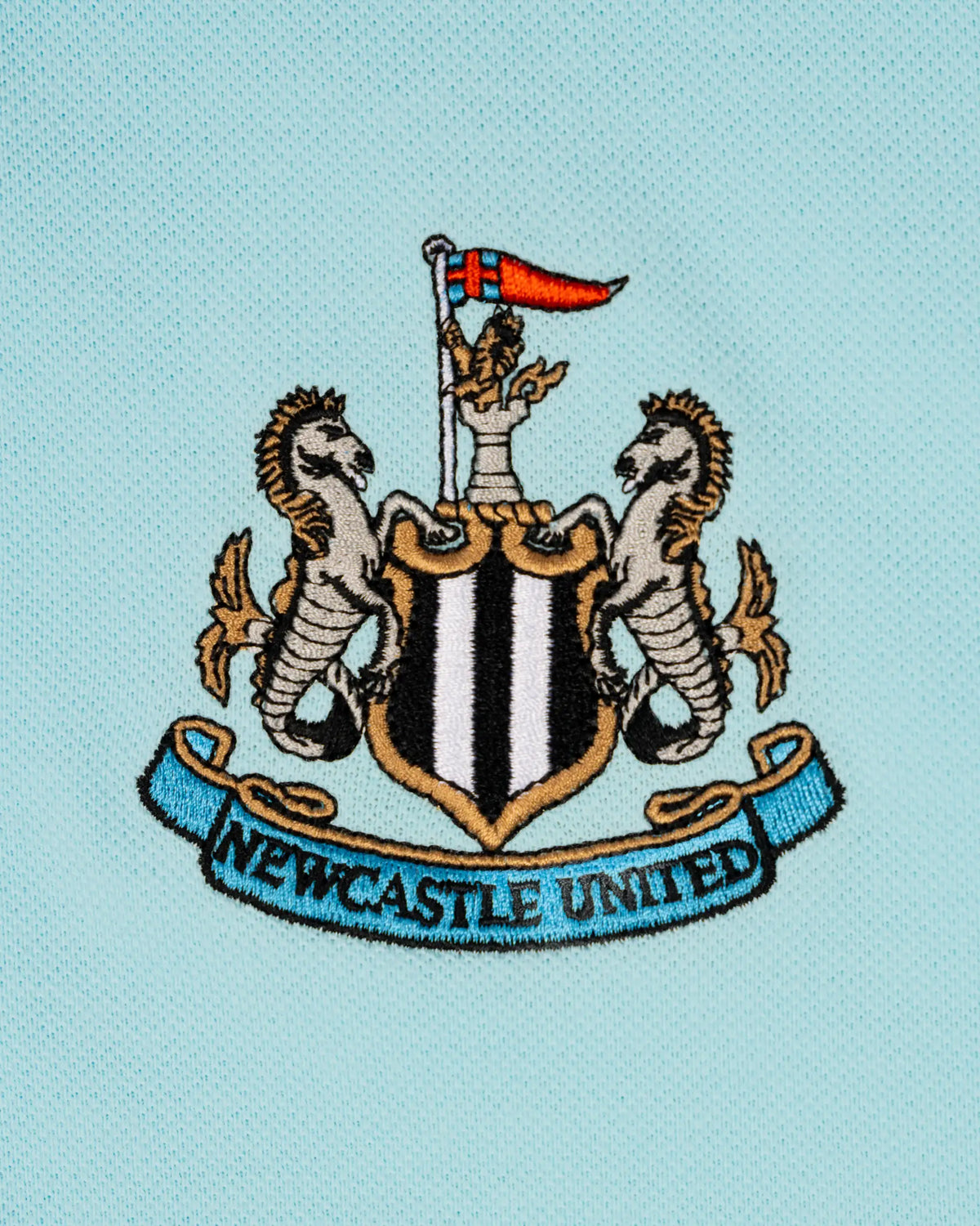 Newcastle United Men's Essentials Range Blue Polo Shirt