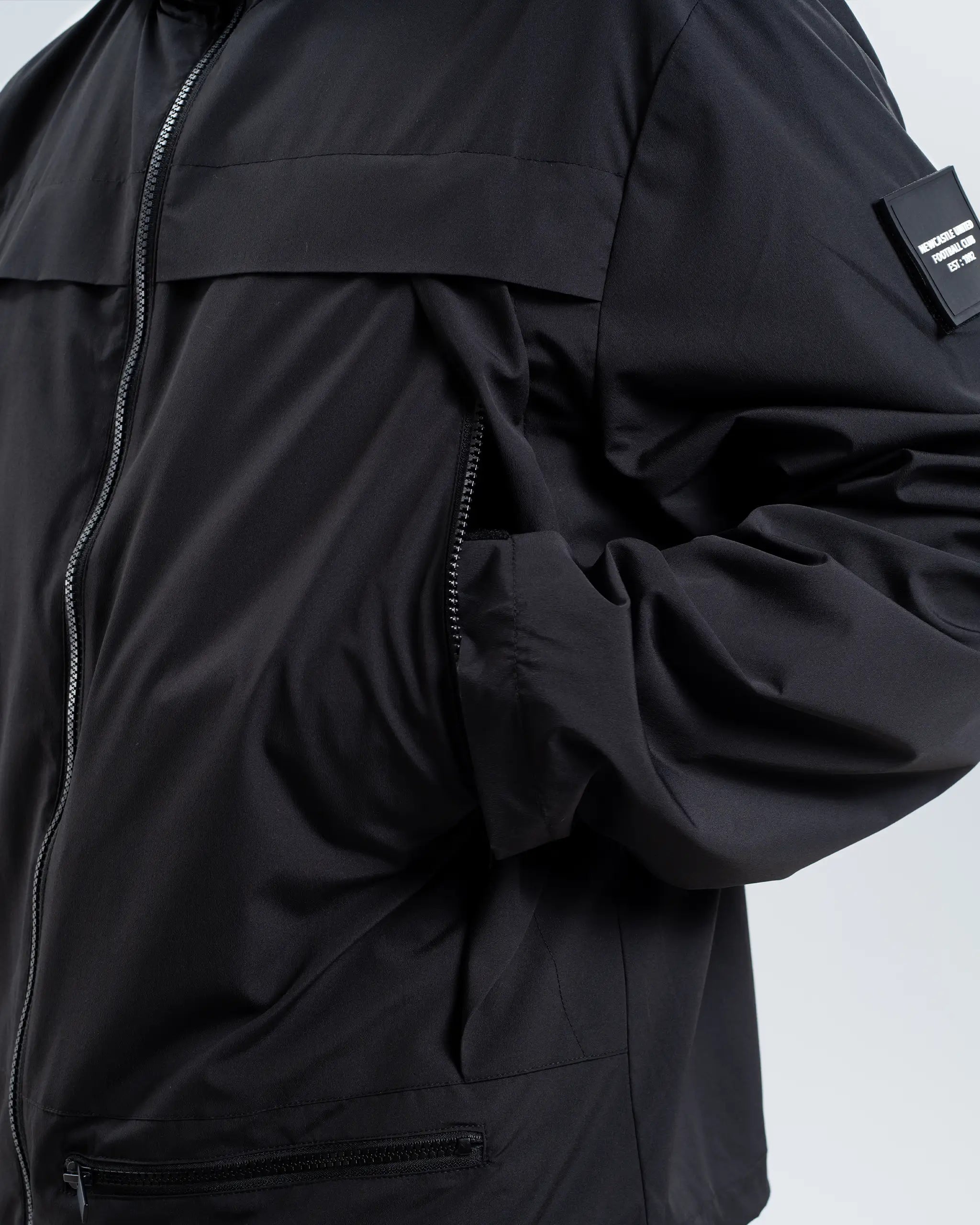 Newcastle United Black Hooded Shower Jacket