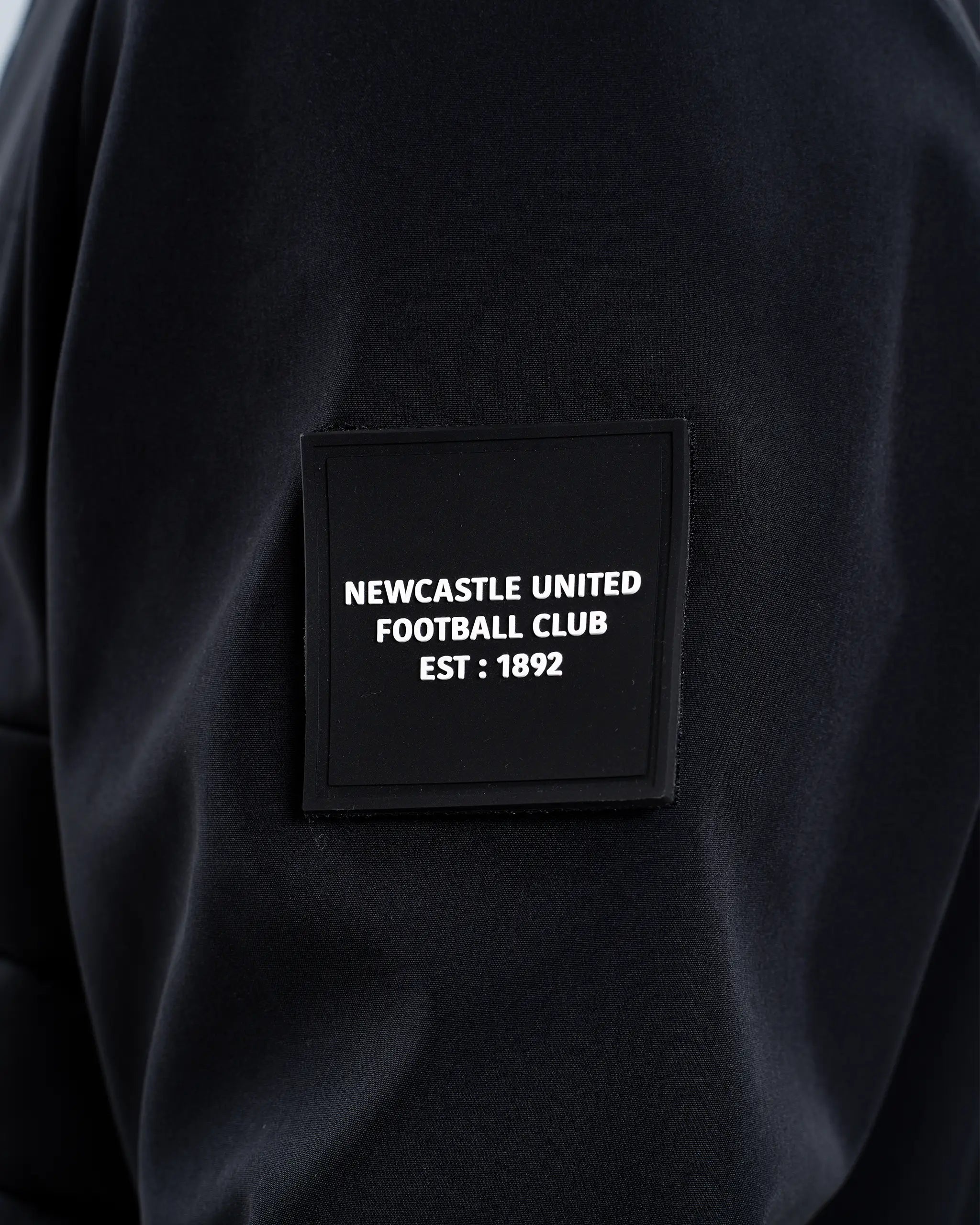 Newcastle United Black Hooded Hybrid Jacket