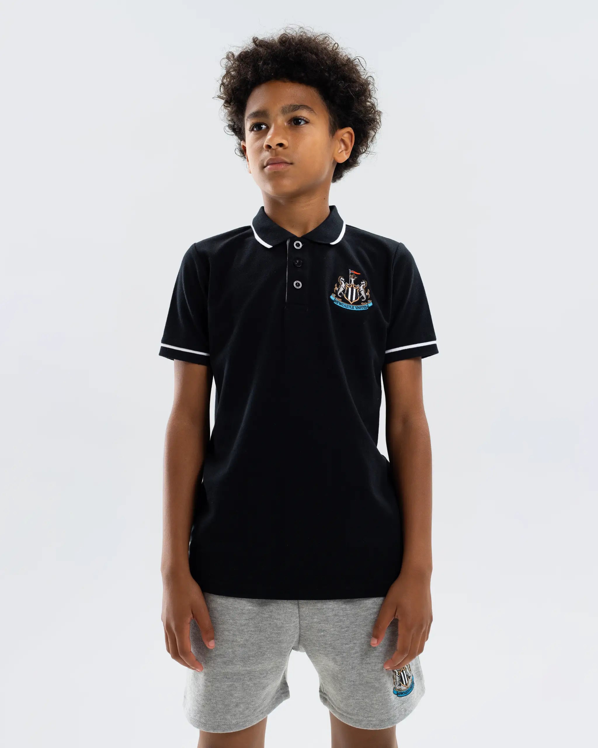 Newcastle United Kids' Essentials Range Black Polo Shirt