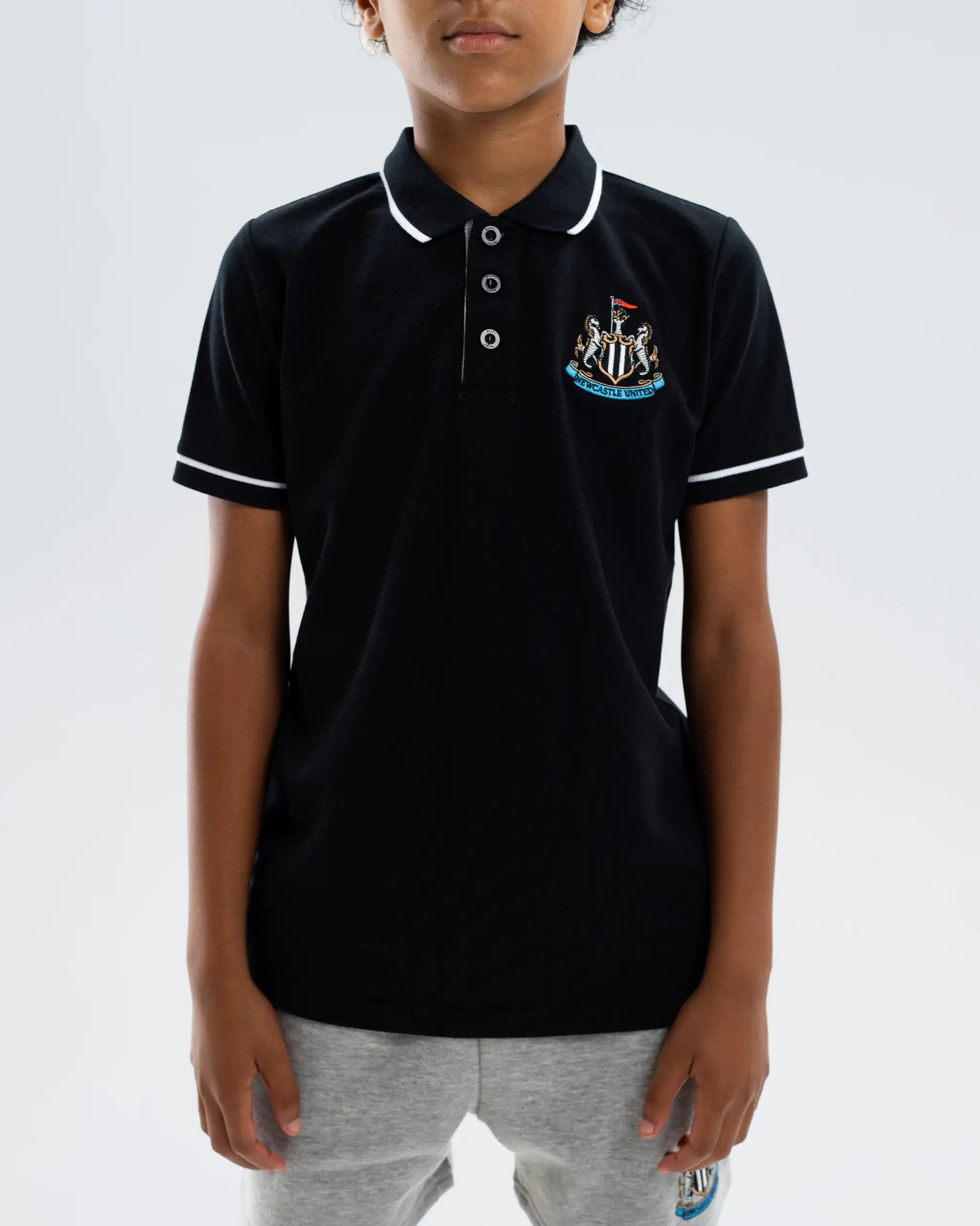 Newcastle United Kids' Essentials Range Black Polo Shirt