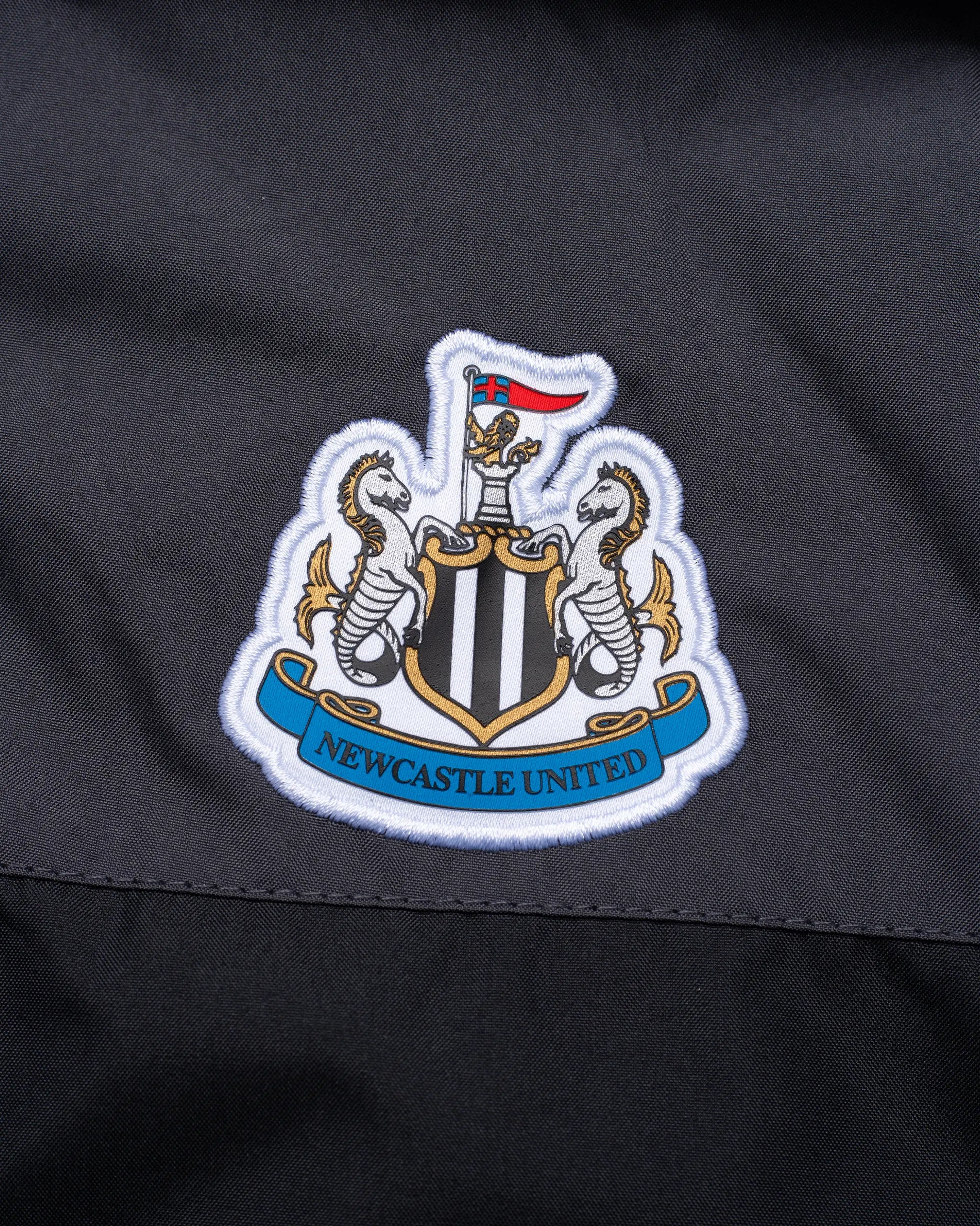 Newcastle United Kids' Charcoal Terrace Two Tone Shower Jacket