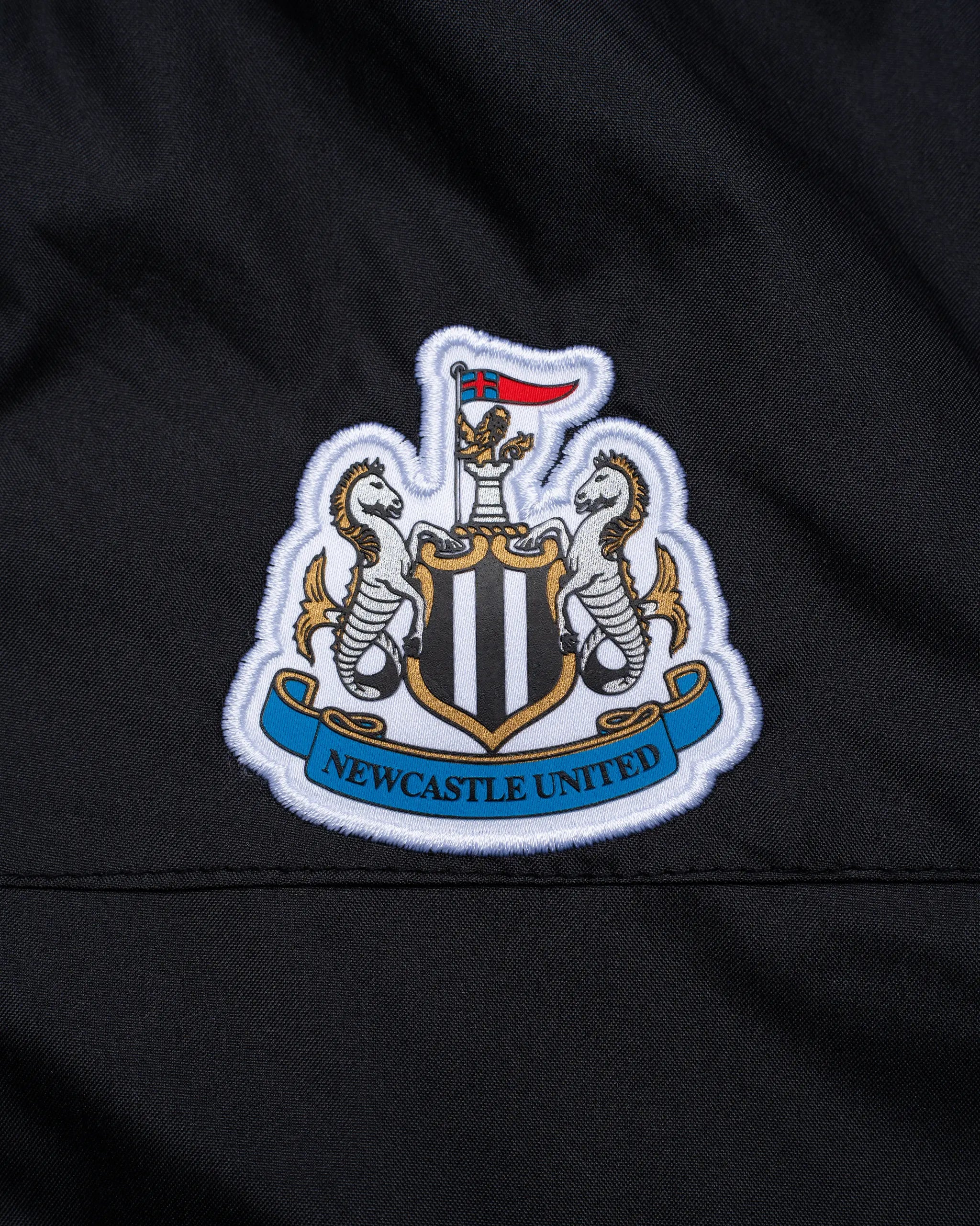 Newcastle United Girl's Black Terrace Shower Jacket