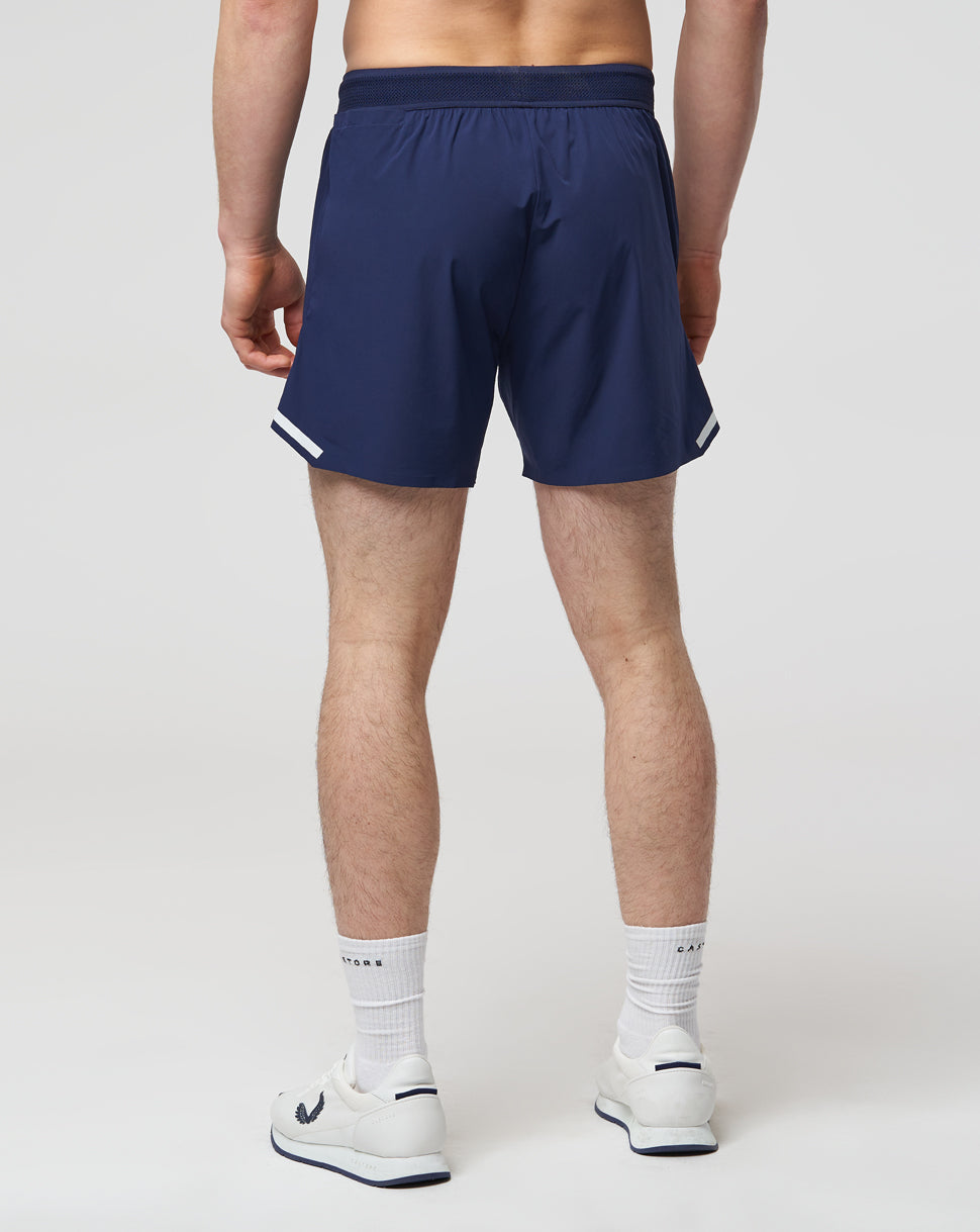 Navy pace shorts with white Castore logo